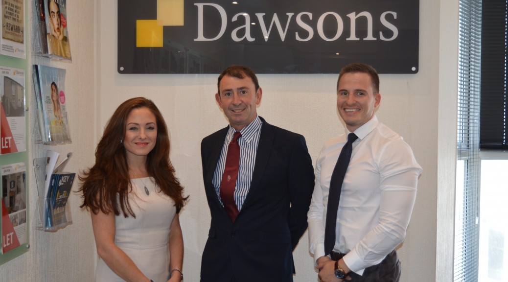 L-R Dawsons’ Mumbles Branch Manager Emma Bolton, Mumbles RFC Chairman Simon Evans, and Tom Hope of Dawsons’ Fine and Country Department