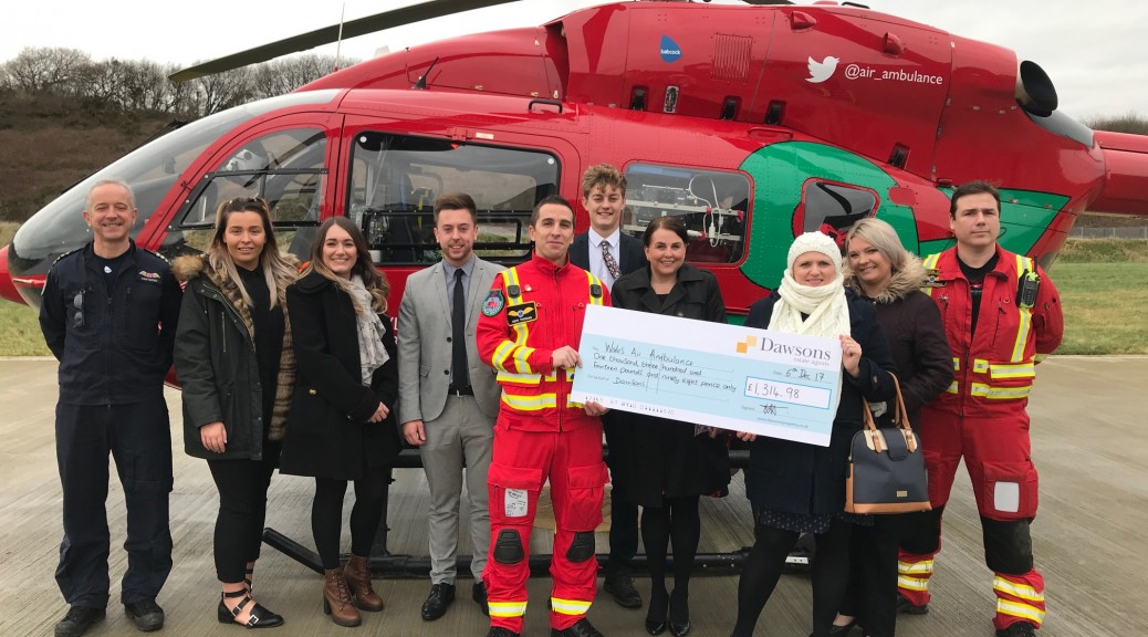 Dawsons hand over cheque to Wales Air Ambulance