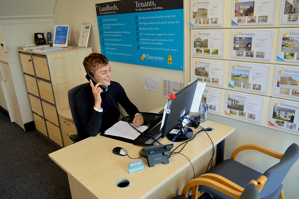 Estate Agent on the Phone to a property seller in Killay Swansea