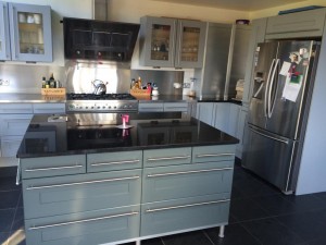 Renovate by repainting the kitchen doors to add new life to old units